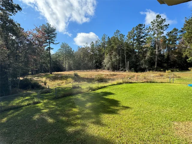 a view of a lake with a yard