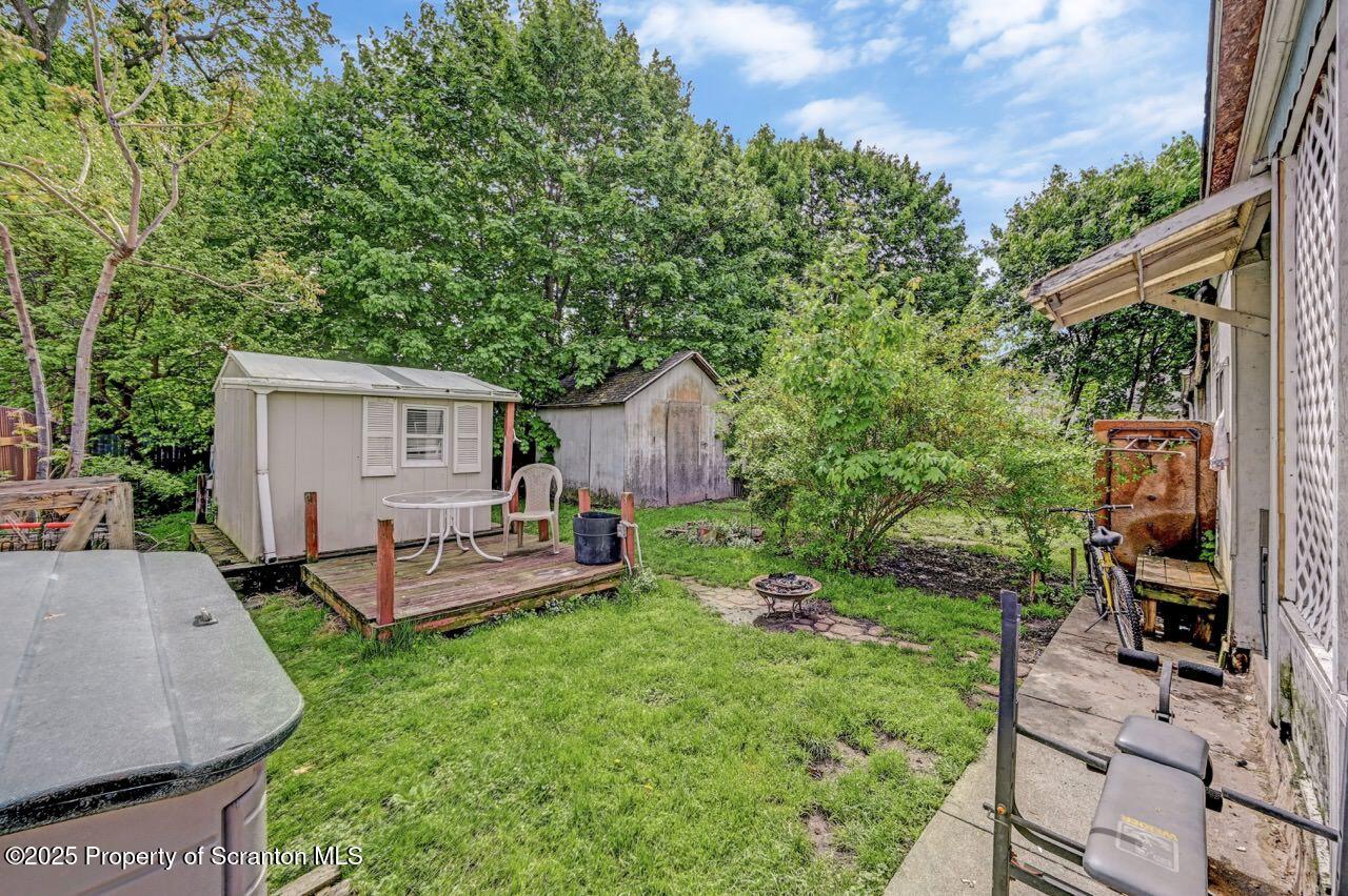942 Providence Road Scranton, PA 18508 - Photo 25 of 25 a view of a house with backyard sitting area and garden
