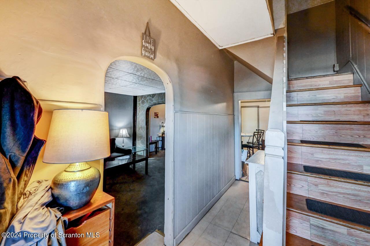 942 Providence Road Scranton, PA 18508 - Photo 3 of 25 a view of hallway with living room and furniture