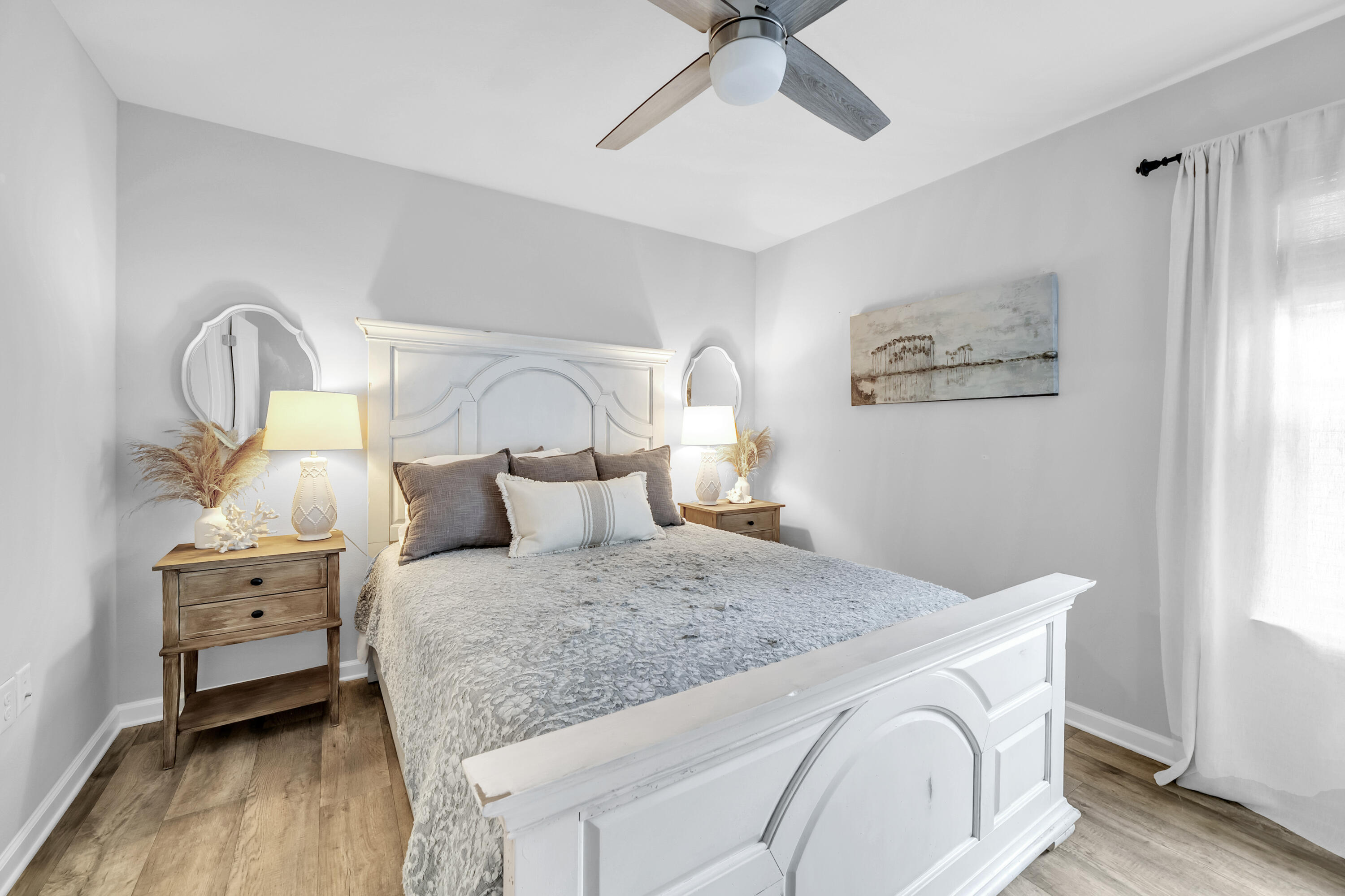 605 Earl Godwin Road Freeport, FL 32439 - Photo 14 of 47 a bedroom with a bed and a chandelier