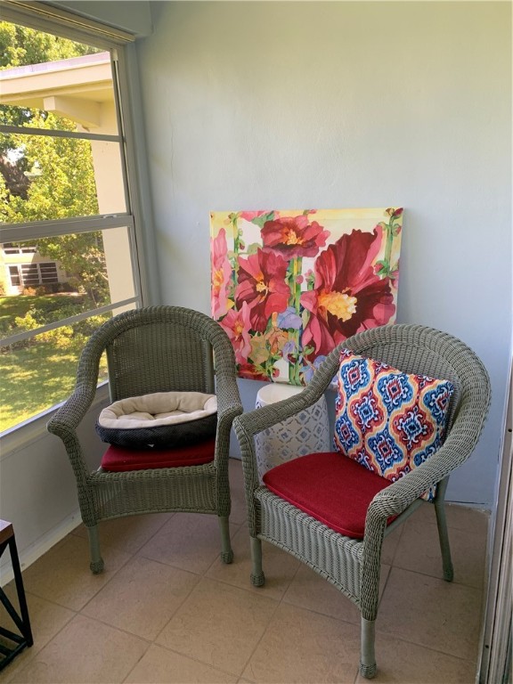 1100 Ponce De Leon Circle, Unit E306 Vero Beach, FL 32960 - Photo 12 of 30 a living room with furniture and a window