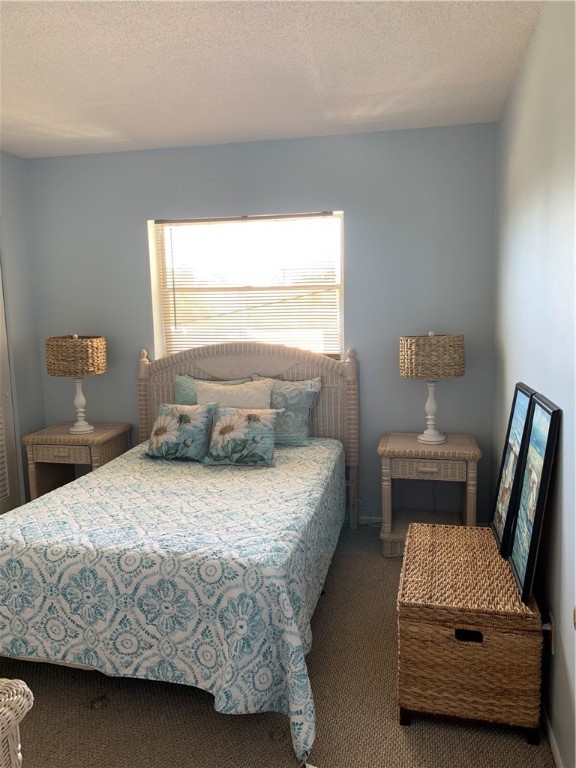 1100 Ponce De Leon Circle, Unit E306 Vero Beach, FL 32960 - Photo 21 of 30 a bedroom with a bed and window