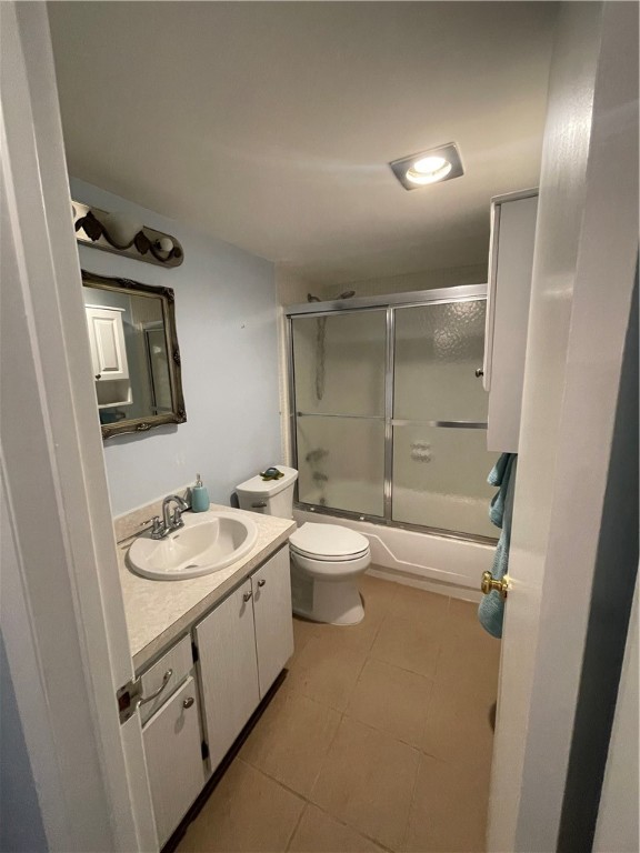 1100 Ponce De Leon Circle, Unit E306 Vero Beach, FL 32960 - Photo 28 of 30 a bathroom with a double vanity sink toilet mirror and shower