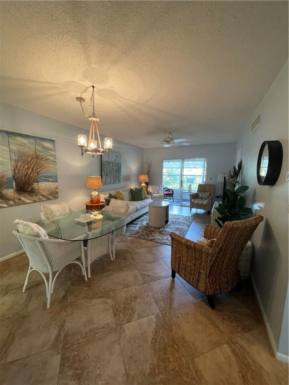 1100 Ponce De Leon Circle, Unit E306 Vero Beach, FL 32960 - Photo 7 of 30 a living room with furniture and a chandelier