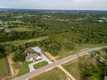 a view of a lake with a yard