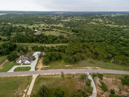 a view of a lake with a yard
