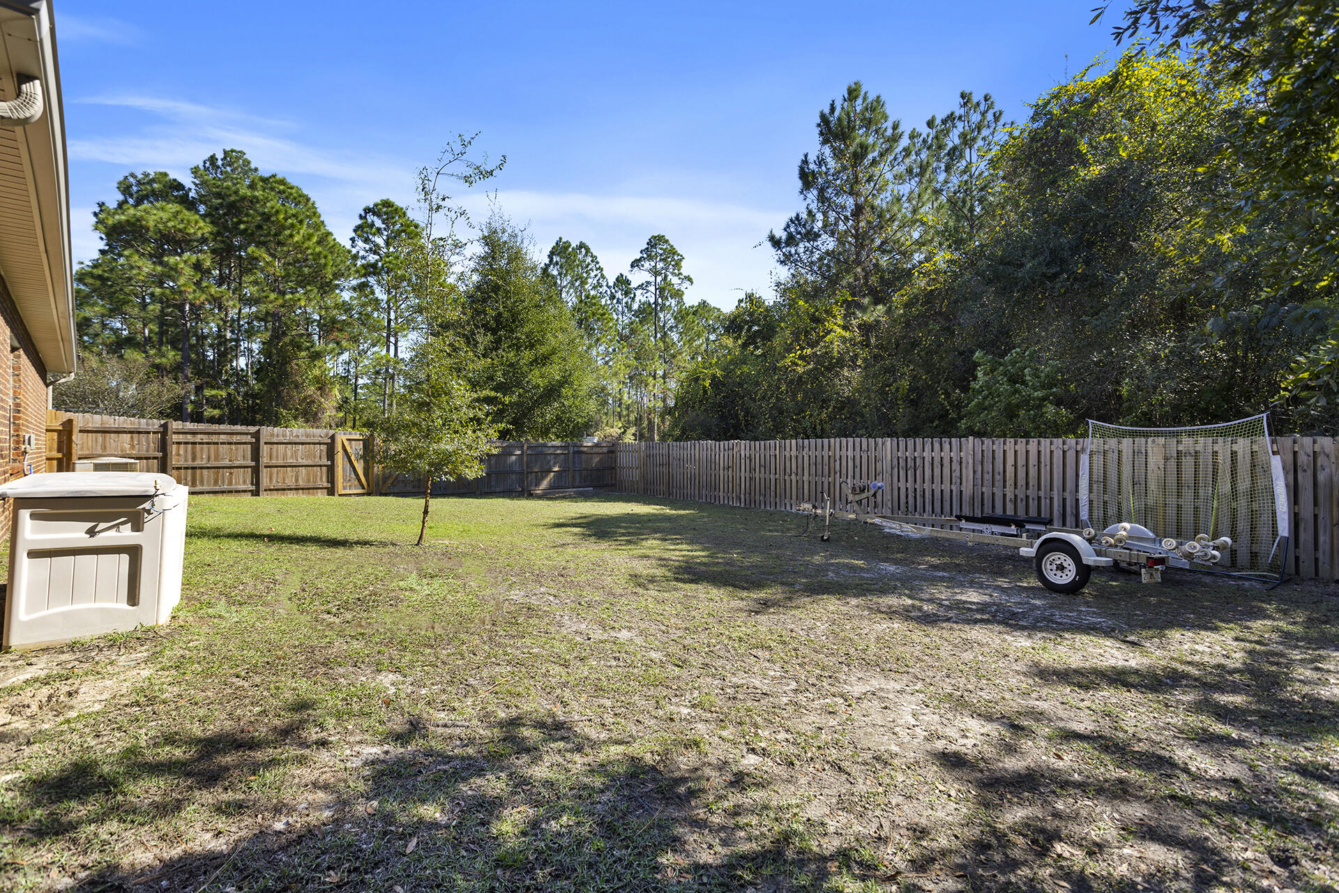 137 Old Ferry Road Santa Rosa Beach, FL 32459 - Photo 14 of 38 a view of a backyard with swings