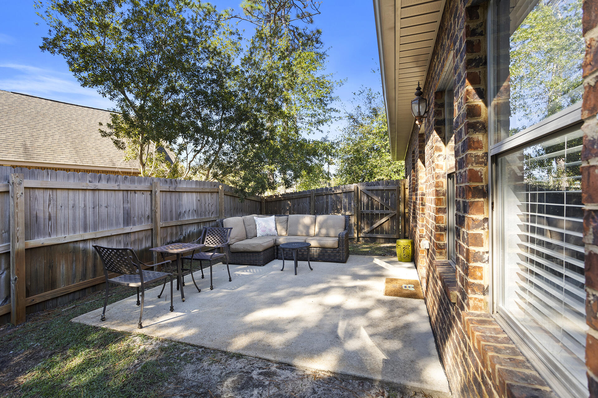 137 Old Ferry Road Santa Rosa Beach, FL 32459 - Photo 16 of 38 a view of backyard with a table and chairs
