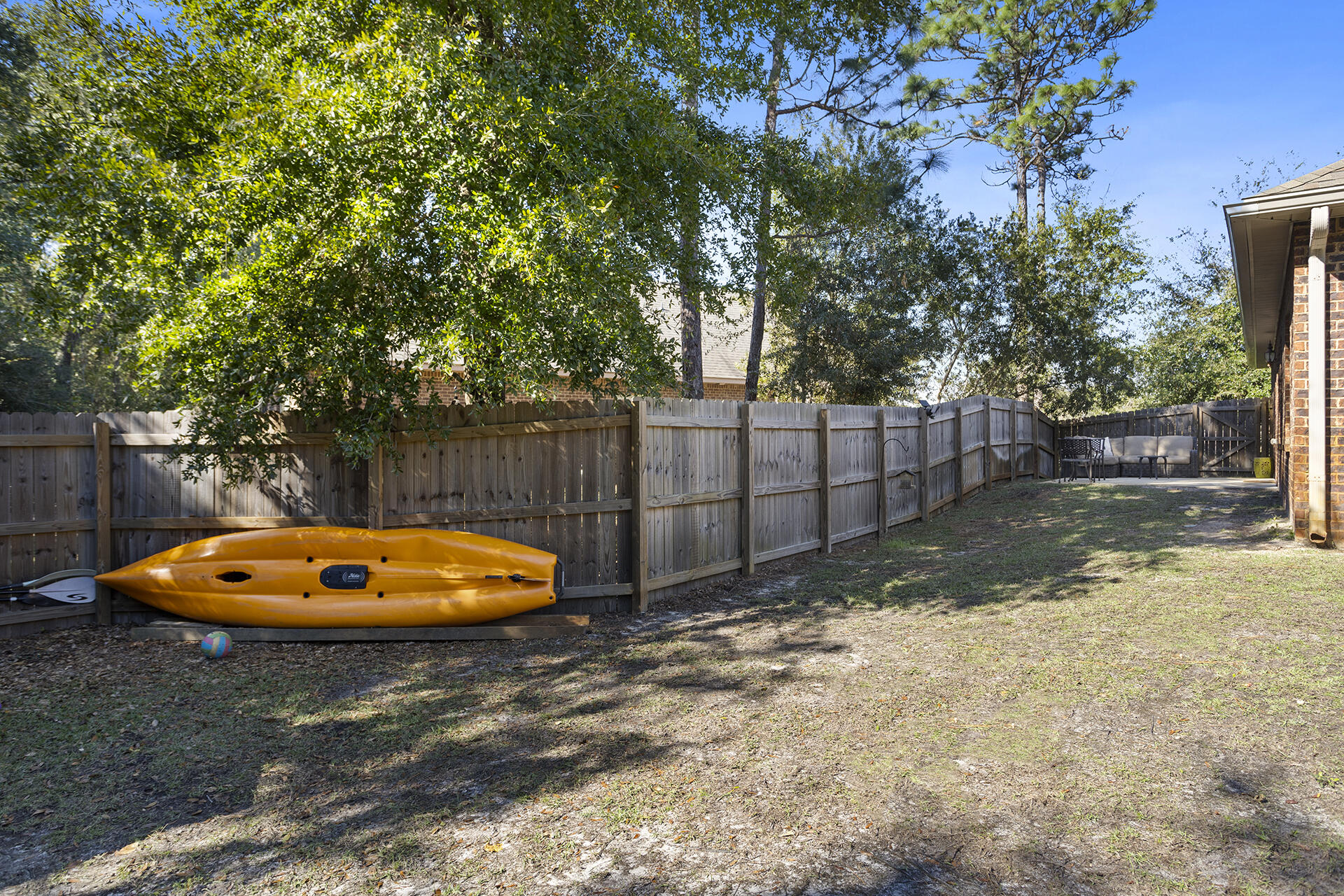 137 Old Ferry Road Santa Rosa Beach, FL 32459 - Photo 17 of 38 a backyard of a house with trees