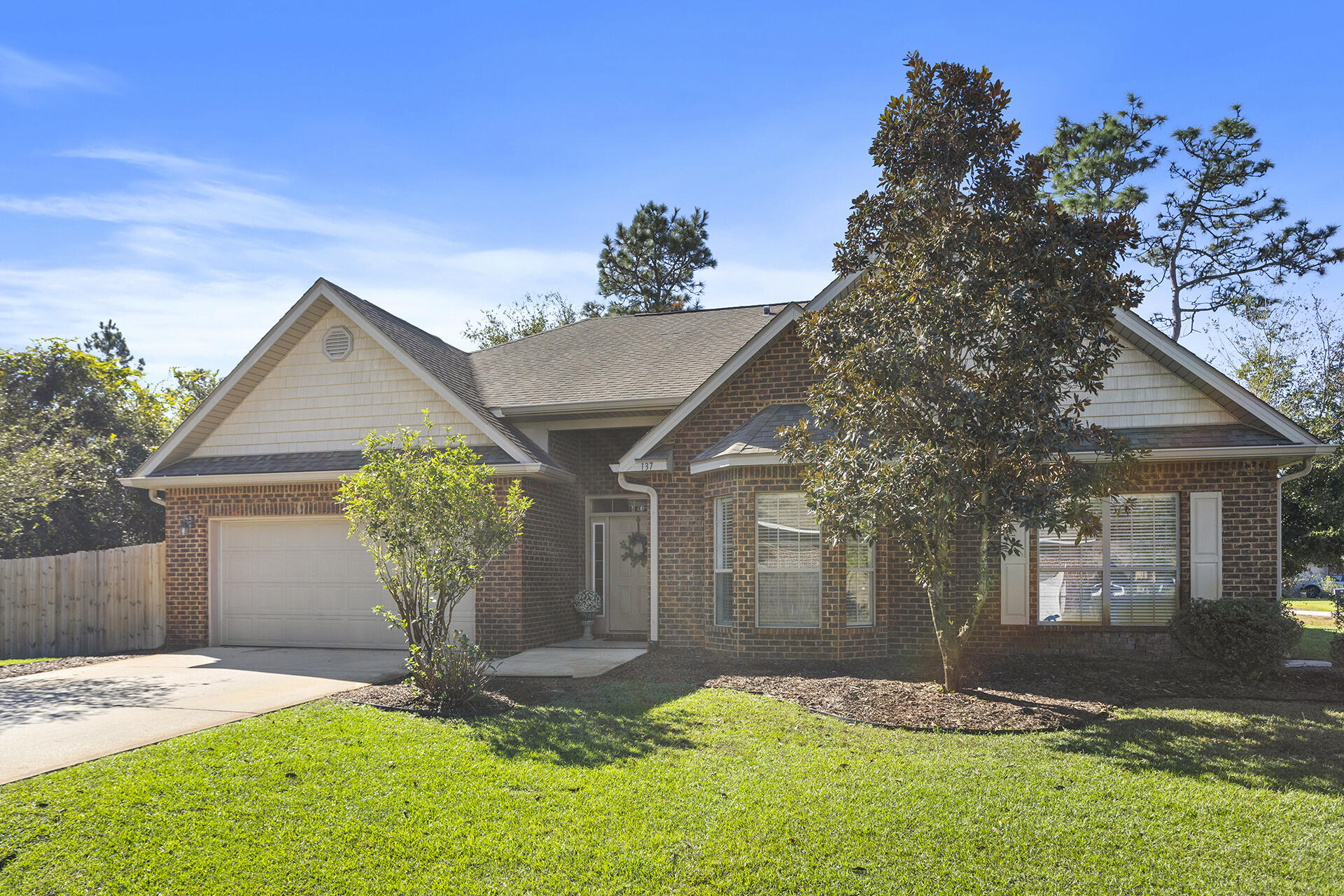 137 Old Ferry Road Santa Rosa Beach, FL 32459 - Photo 18 of 38 a front view of a house with garden