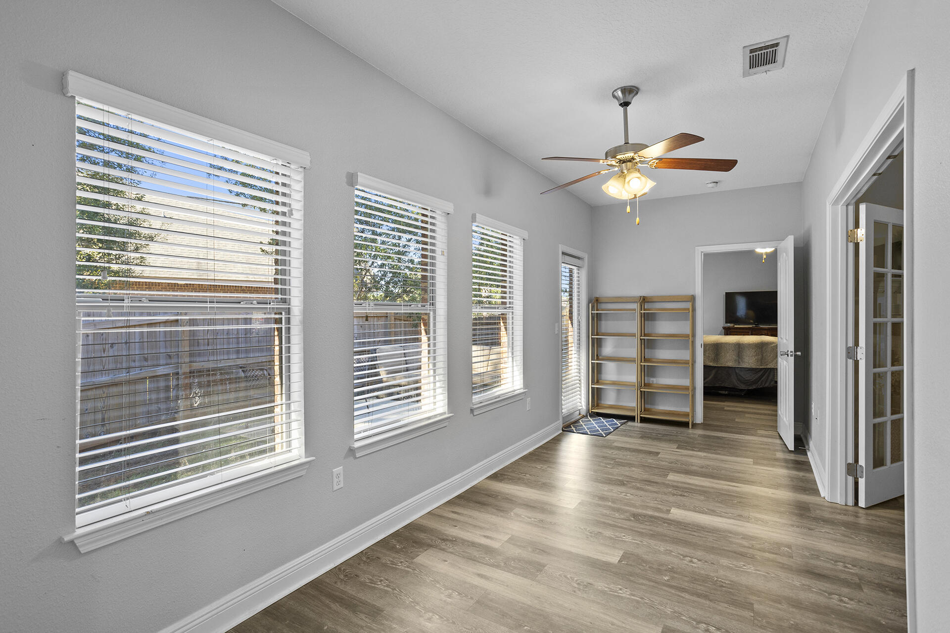 137 Old Ferry Road Santa Rosa Beach, FL 32459 - Photo 30 of 38 a view of empty room with wooden floor and fan