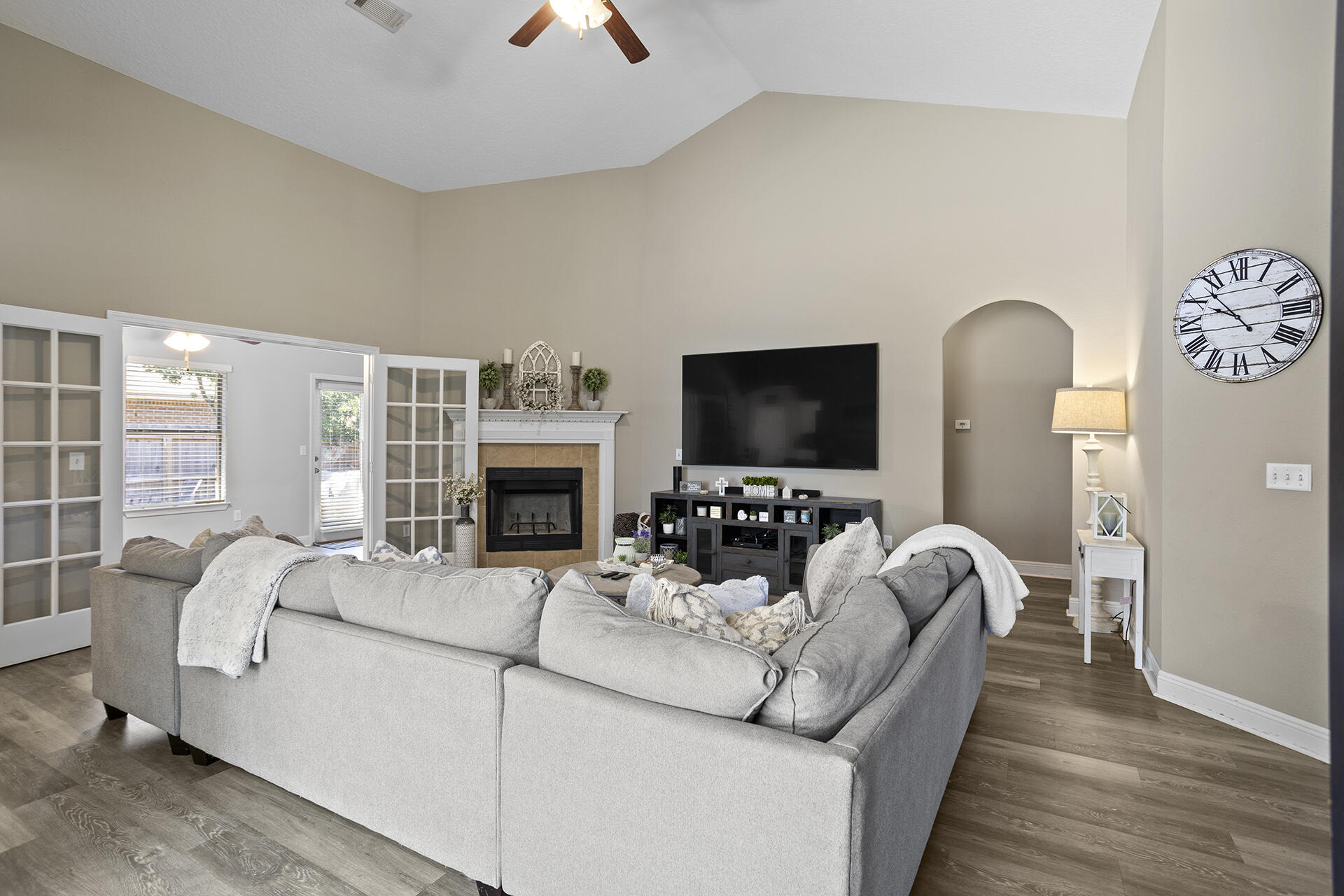 137 Old Ferry Road Santa Rosa Beach, FL 32459 - Photo 34 of 38 a living room with furniture a flat screen tv and a fireplace