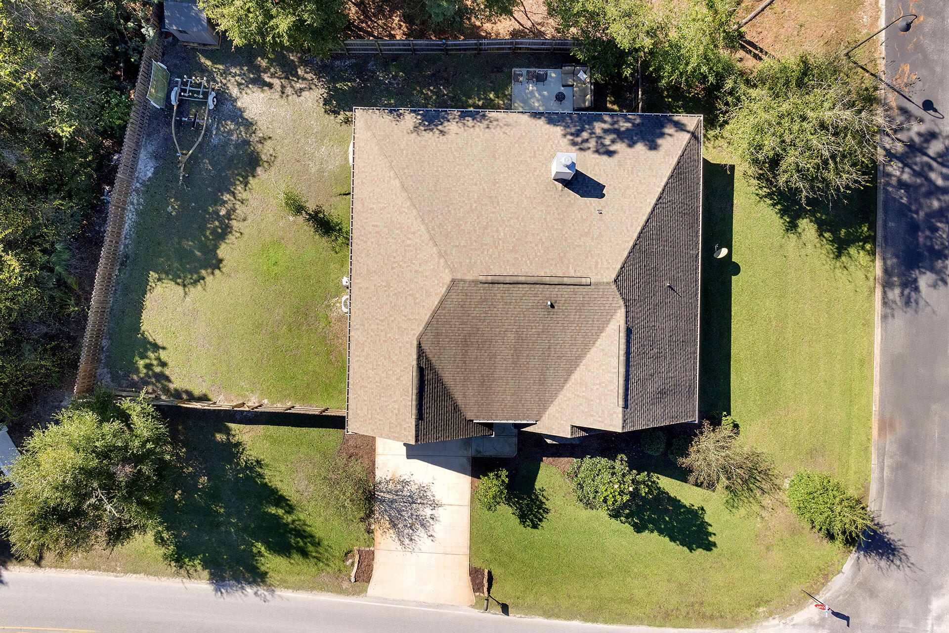 137 Old Ferry Road Santa Rosa Beach, FL 32459 - Photo 4 of 38 an aerial view of a house with a yard and a wooden fence