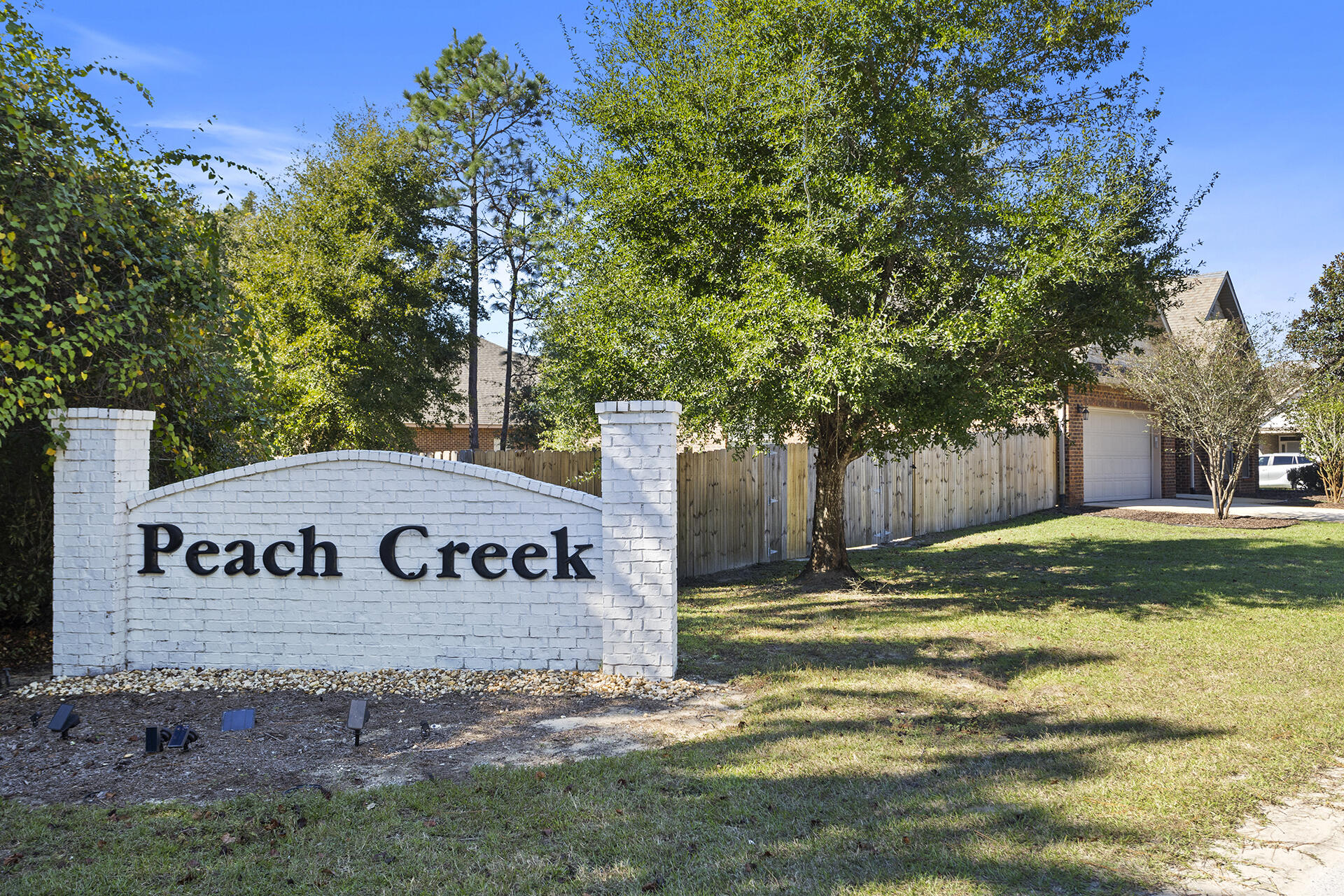 137 Old Ferry Road Santa Rosa Beach, FL 32459 - Photo 6 of 38 a sign board with tree in front of it