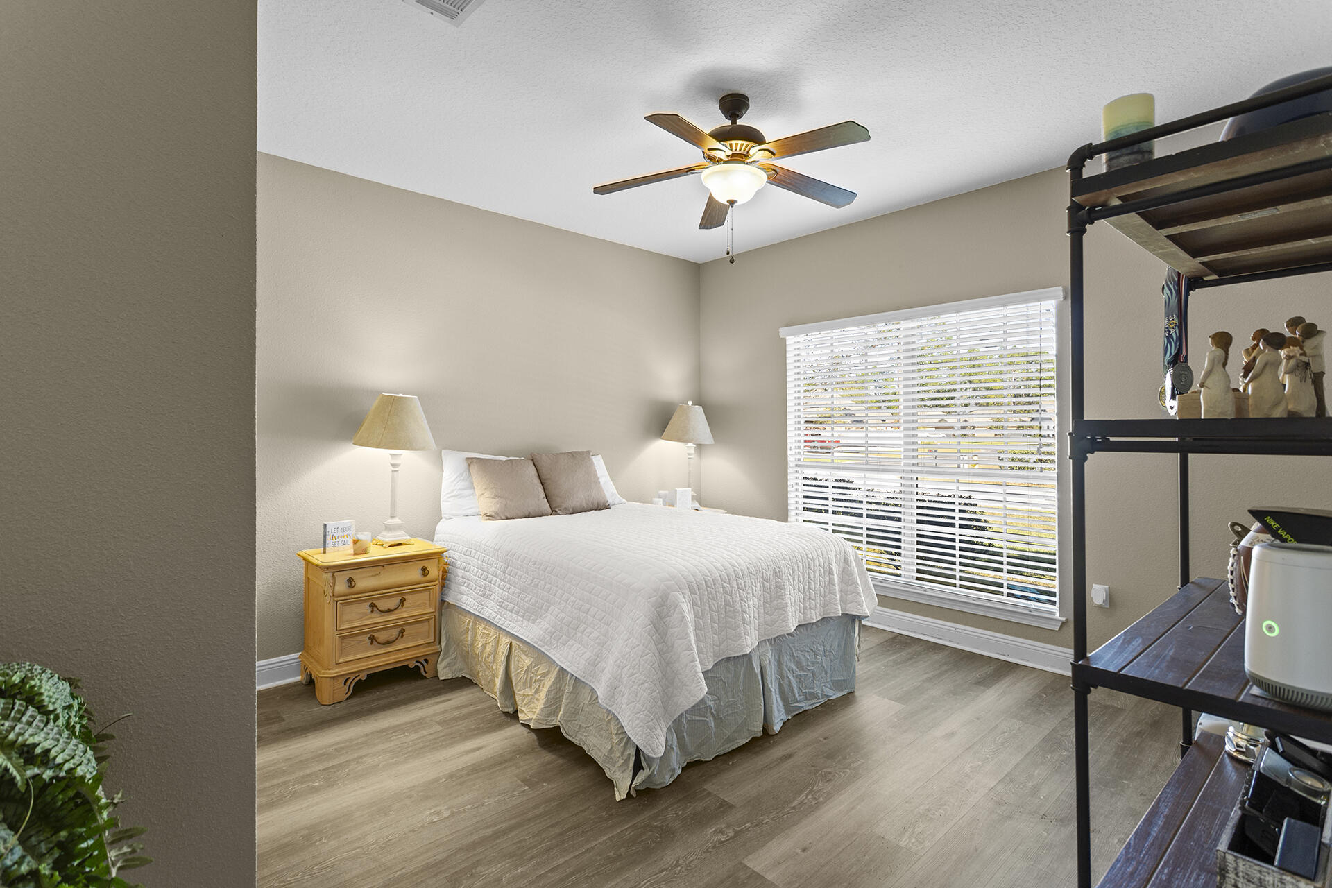 137 Old Ferry Road Santa Rosa Beach, FL 32459 - Photo 9 of 38 a bedroom with a bed and a chandelier