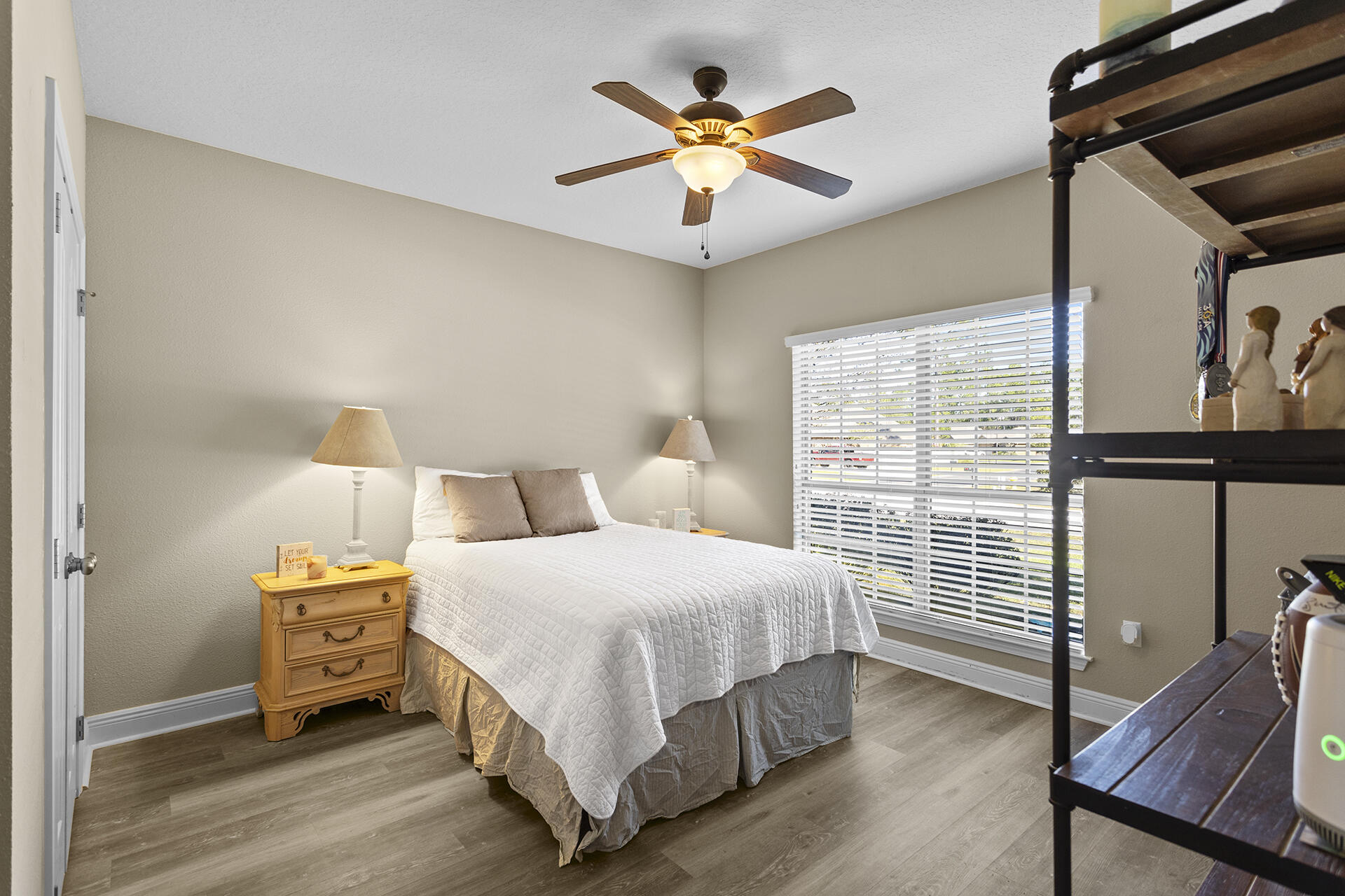 137 Old Ferry Road Santa Rosa Beach, FL 32459 - Photo 10 of 38 a bedroom with a bed and a chandelier