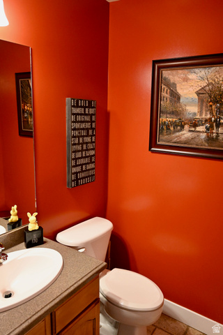 314 Brown Farm Lane Draper, UT 84020 - Photo 13 of 57 Powder room featuring a single-sink vanity with wood cabinetry, a light-colored countertop, and an oval undermount sink