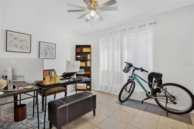 a view of a livingroom with furniture and gym equipment