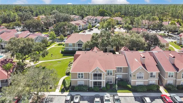 an aerial view of house with yard