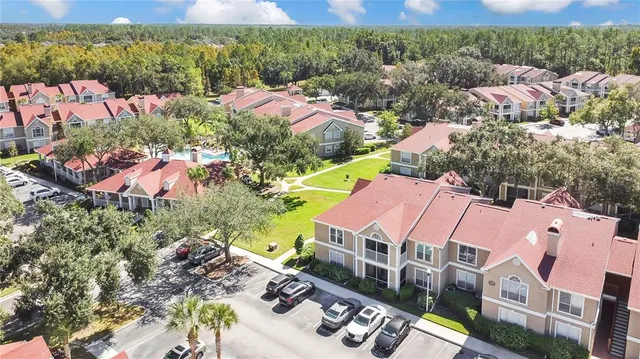 an aerial view of house with yard