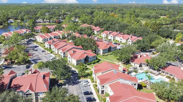 an aerial view of house with yard