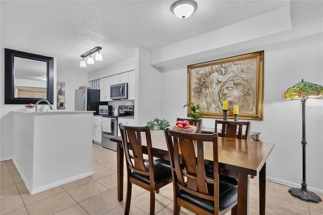 a view of a dining room with furniture and a livingroom