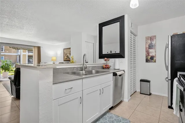 a bathroom with a double vanity sink and mirror