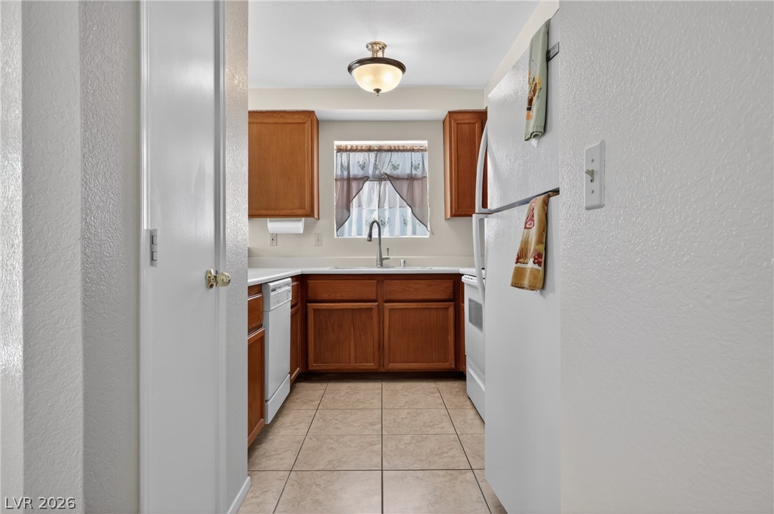 2241 Highpointe Drive, Unit 101 Laughlin, NV 89029 - Photo 9 of 23 This compact kitchen maximizes space with efficient design and modern amenities.