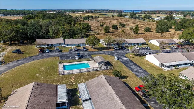 an aerial view of a house with a ocean view