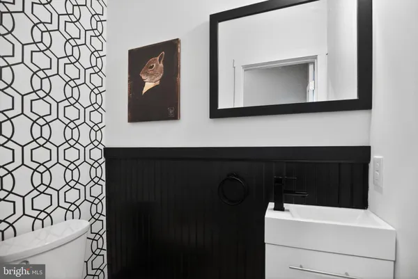 a utility room with a sink and a vanity