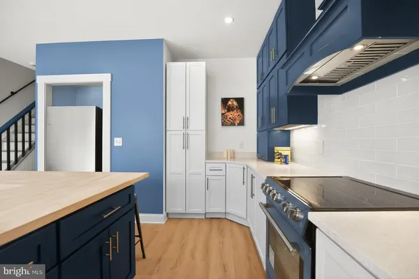 a kitchen with a sink dishwasher stove and refrigerator