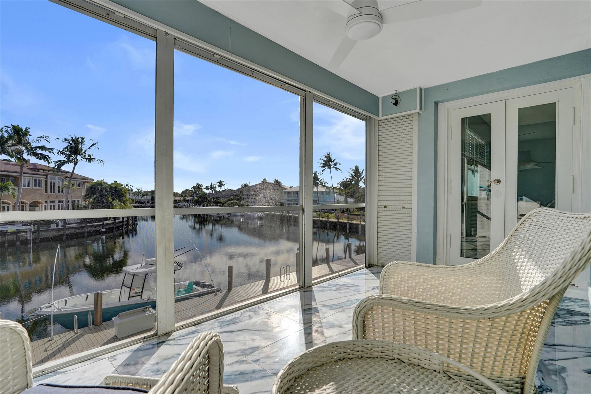 2330 Northeast 36th Street, Unit 9 Lighthouse Point, FL 33064 - Photo 26 of 48 a balcony with furniture and a potted plant