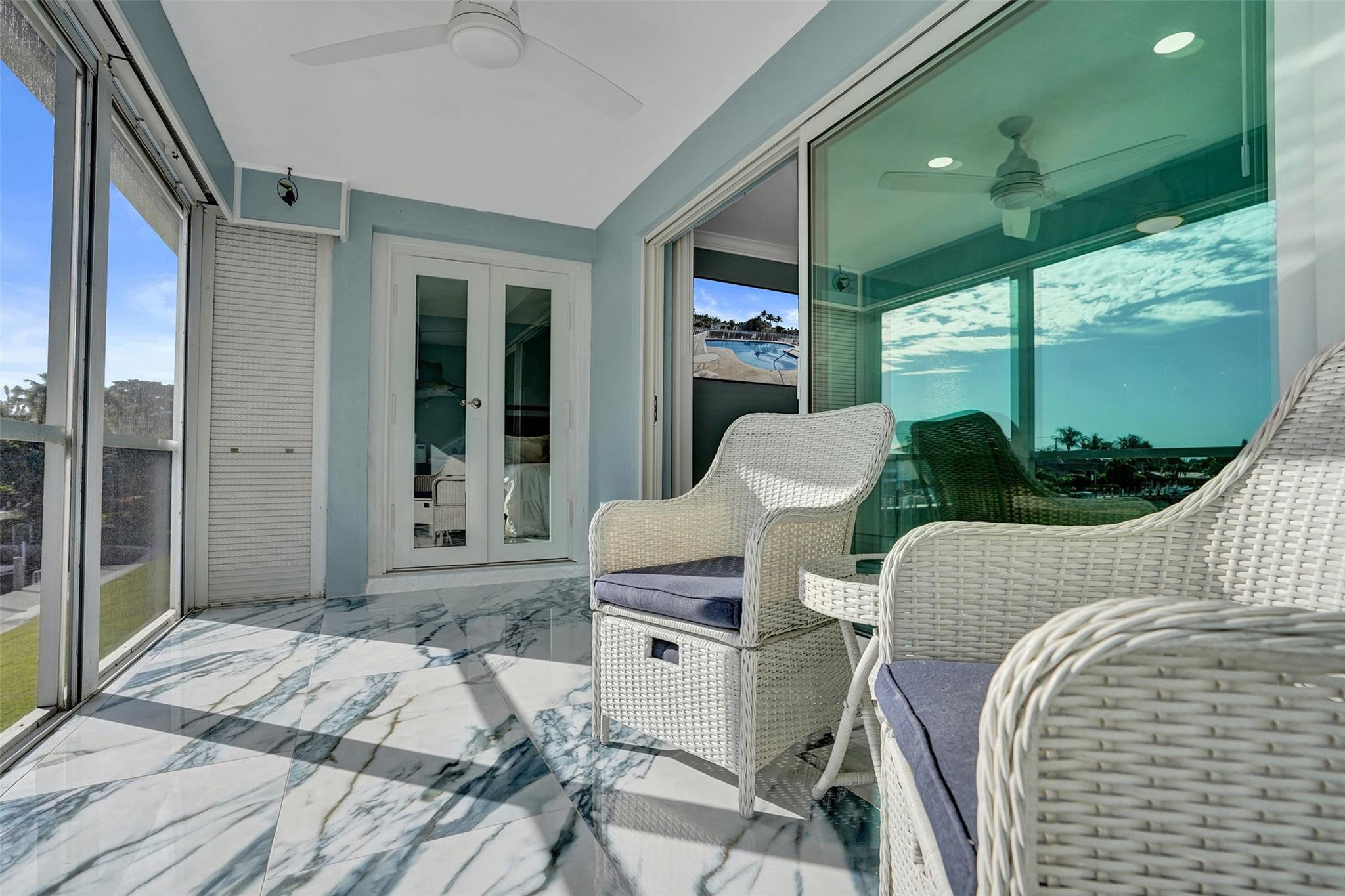 2330 Northeast 36th Street, Unit 9 Lighthouse Point, FL 33064 - Photo 27 of 48 a bedroom with a bed and a table