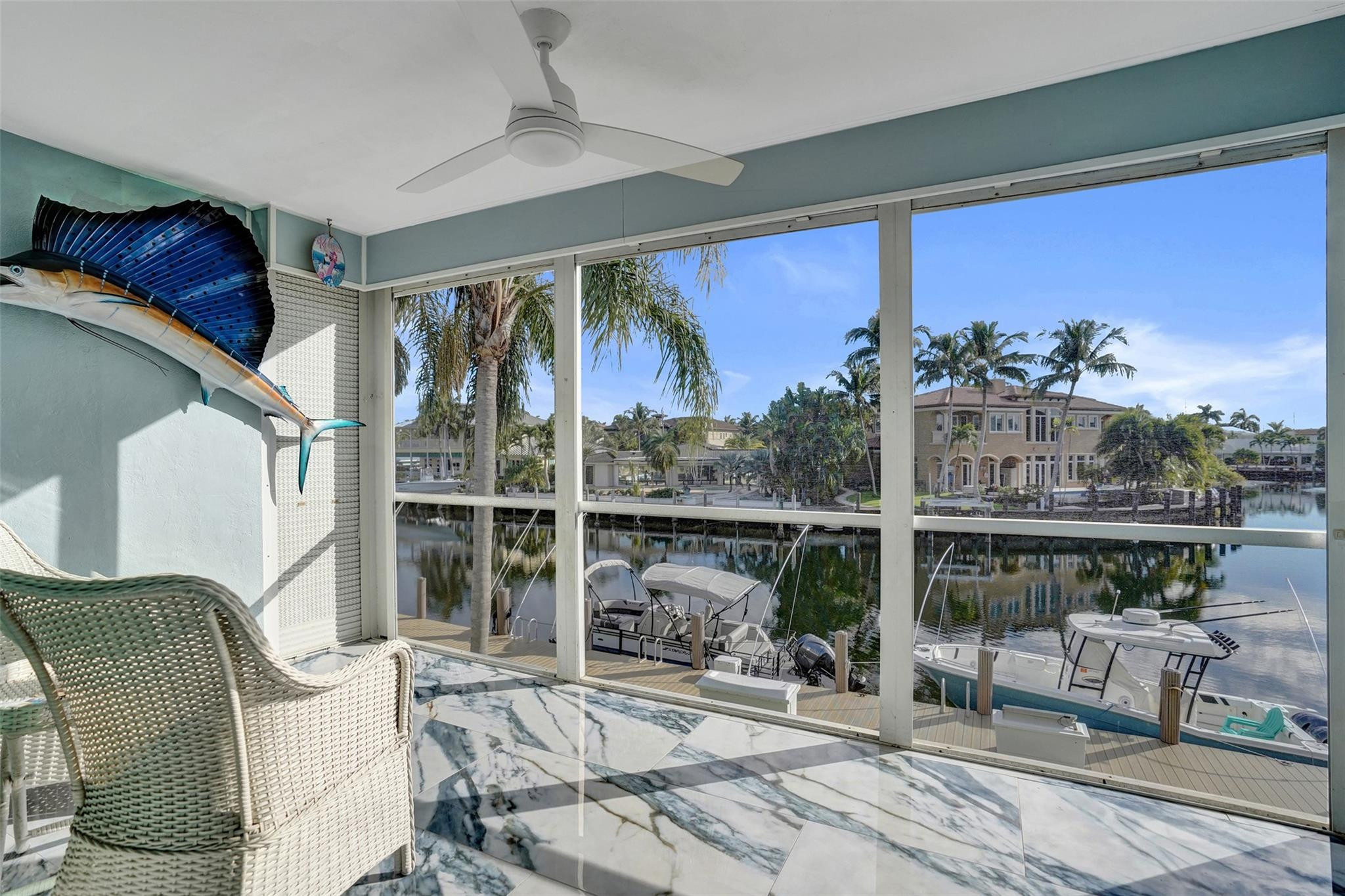 2330 Northeast 36th Street, Unit 9 Lighthouse Point, FL 33064 - Photo 31 of 48 a view of a balcony with chairs and a potted plant