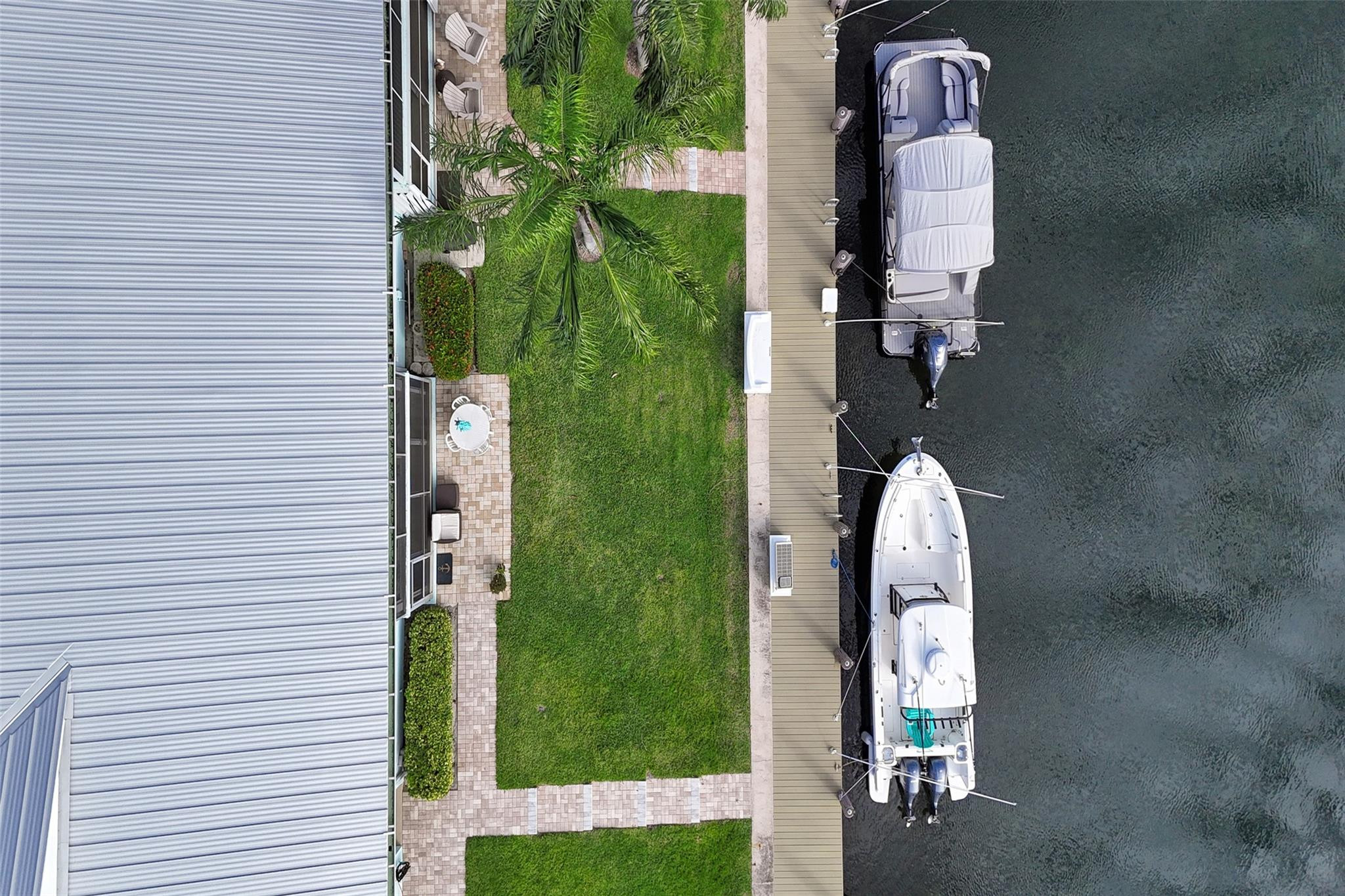 2330 Northeast 36th Street, Unit 9 Lighthouse Point, FL 33064 - Photo 44 of 48 an aerial view of a house with a garden