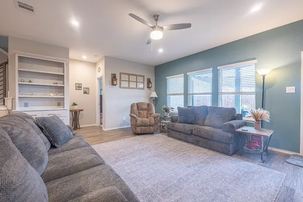 a living room with furniture and a large window