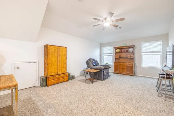 a work room with furniture and a window