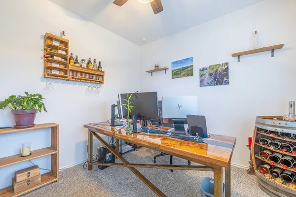 a work room with furniture and wooden floor