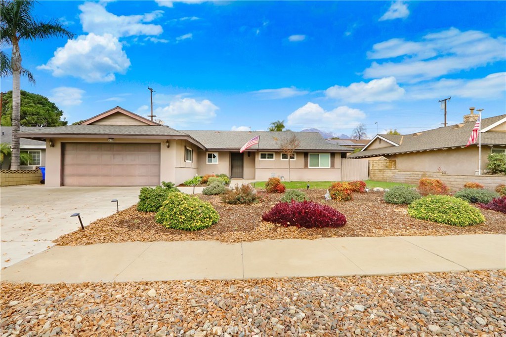 1277 West 14th Street Upland, CA 91786 - Photo 1 of 11 a front view of a house with garden