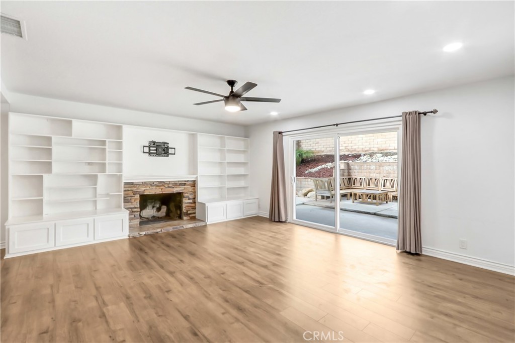 1277 West 14th Street Upland, CA 91786 - Photo 3 of 11 a view of an empty room with a fireplace and a window