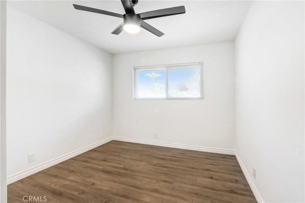 1277 West 14th Street Upland, CA 91786 - Photo 6 of 11 an empty room with a window and ceiling fan