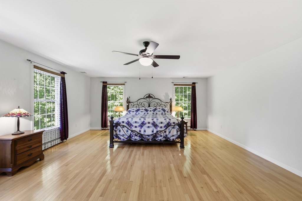 345 Bragg Road Warren, MA 01585 - Photo 23 of 41 a living room with furniture and wooden floor