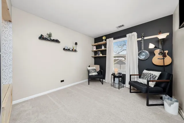 a living room with furniture and a closet
