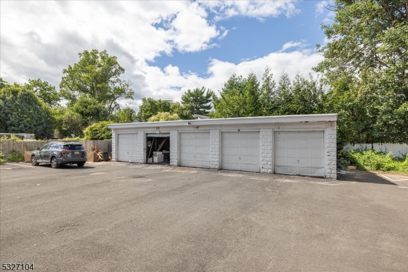 200 Forest Street, Unit R Montclair, NJ 07042 - Photo 12 of 13 front view of a house with a garage and a car