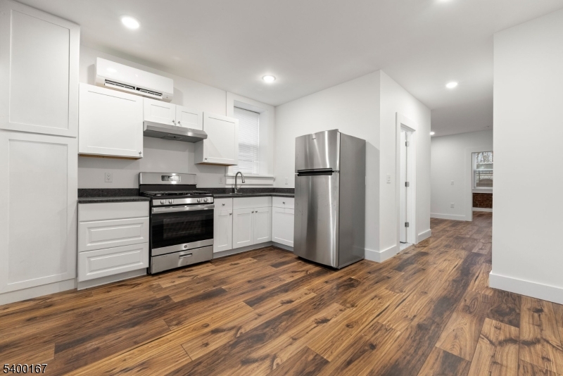 200 Forest Street, Unit R Montclair, NJ 07042 - Photo 2 of 13 a kitchen with stainless steel appliances a refrigerator sink and cabinets