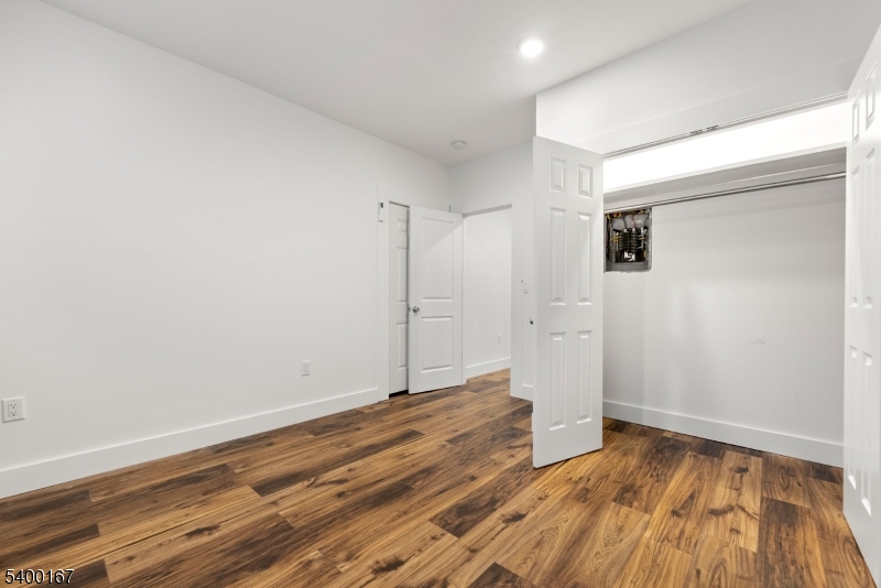 200 Forest Street, Unit R Montclair, NJ 07042 - Photo 10 of 13 a view of a room with wooden floor and white walls