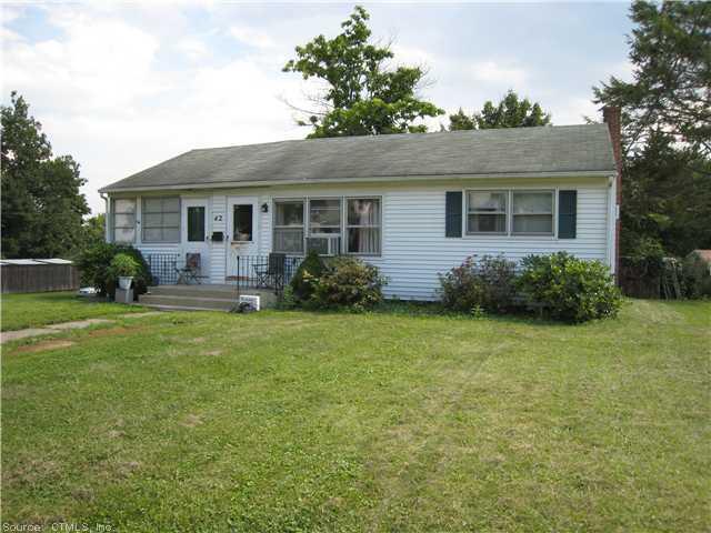 42 Alexander Road New Britain, CT 06053 - Photo 1 of 1 a front view of house with yard and green space