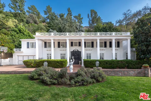 a view of a house with a garden