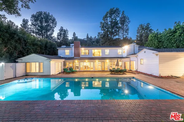 a view of a swimming pool with an outdoor space