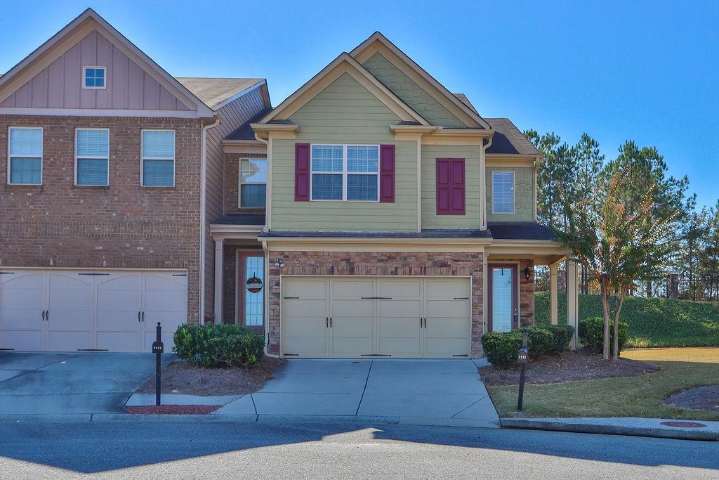 a front view of a house with garden